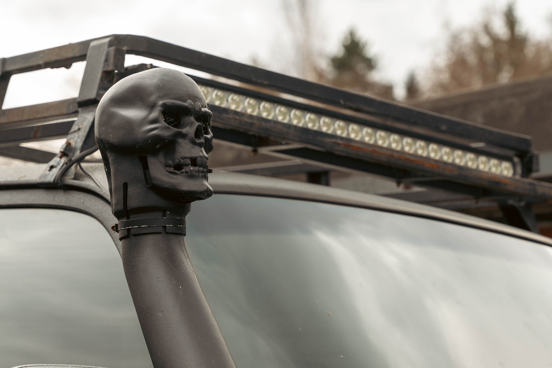 Black skull ornament decorating snorkel of customized off-road vehicle